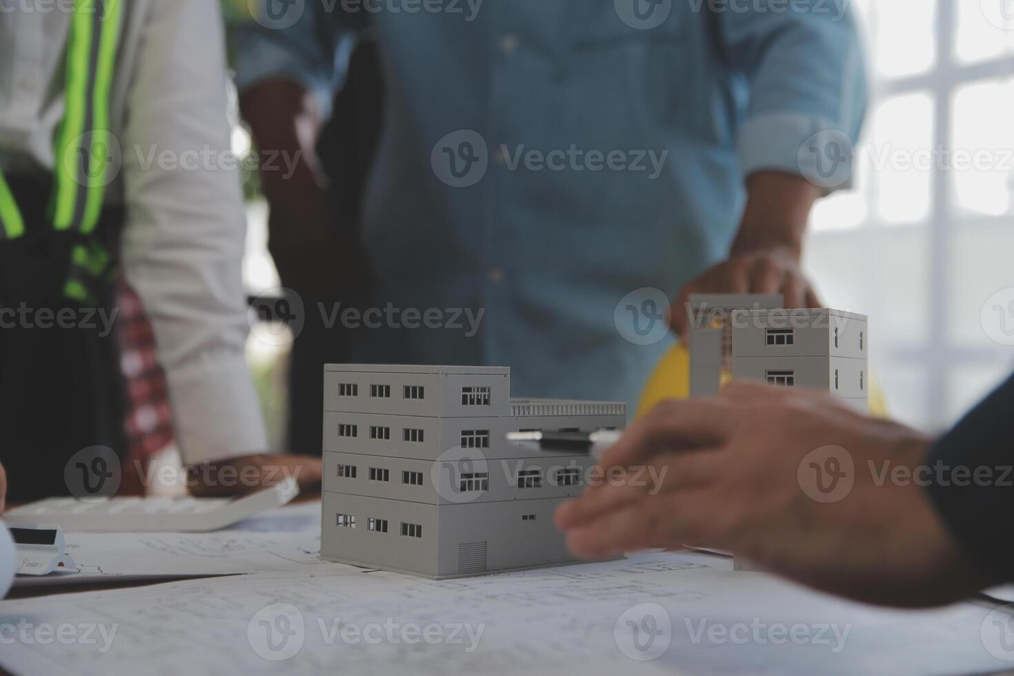 Construction and structure concept of Engineer or architect meeting for project working with partner and engineering tools on model building and blueprint in working site, contract for both companies. photo