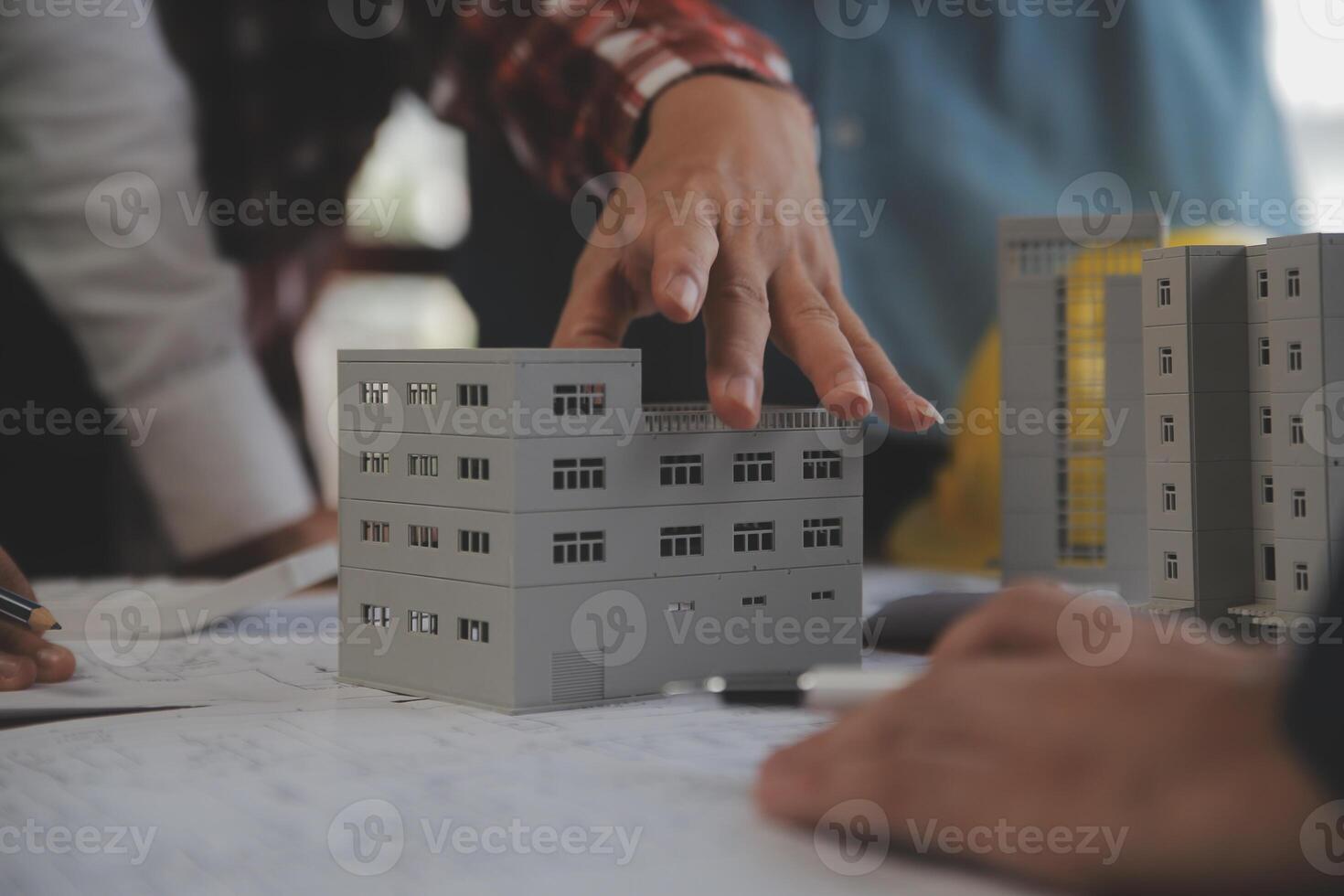 Construction and structure concept of Engineer or architect meeting for project working with partner and engineering tools on model building and blueprint in working site, contract for both companies. photo