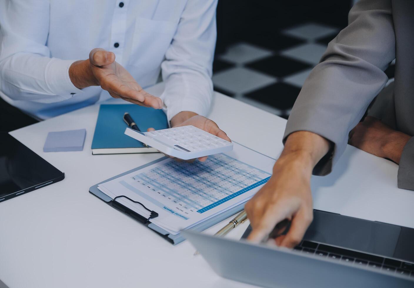 Business team working with new startup project plan and discussion information for financial strategy with laptop and digital tablet in a modern business lounge. photo