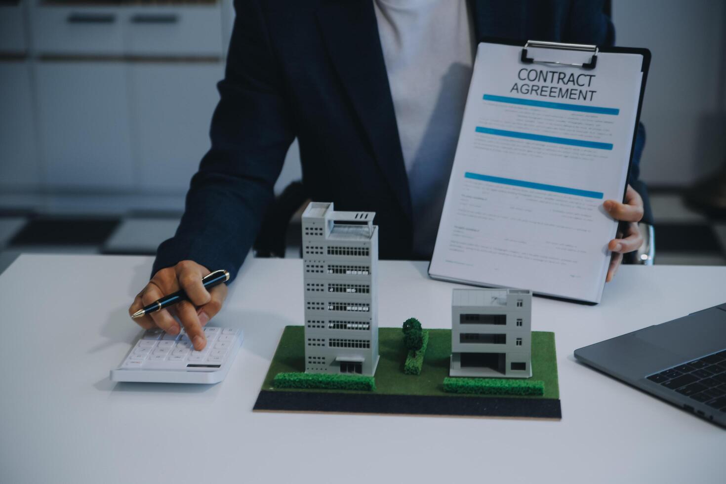Real estate agent talked about the terms of the home purchase agreement and asked the customer to sign the documents to make the contract legally, Home sales and home insurance concept. photo