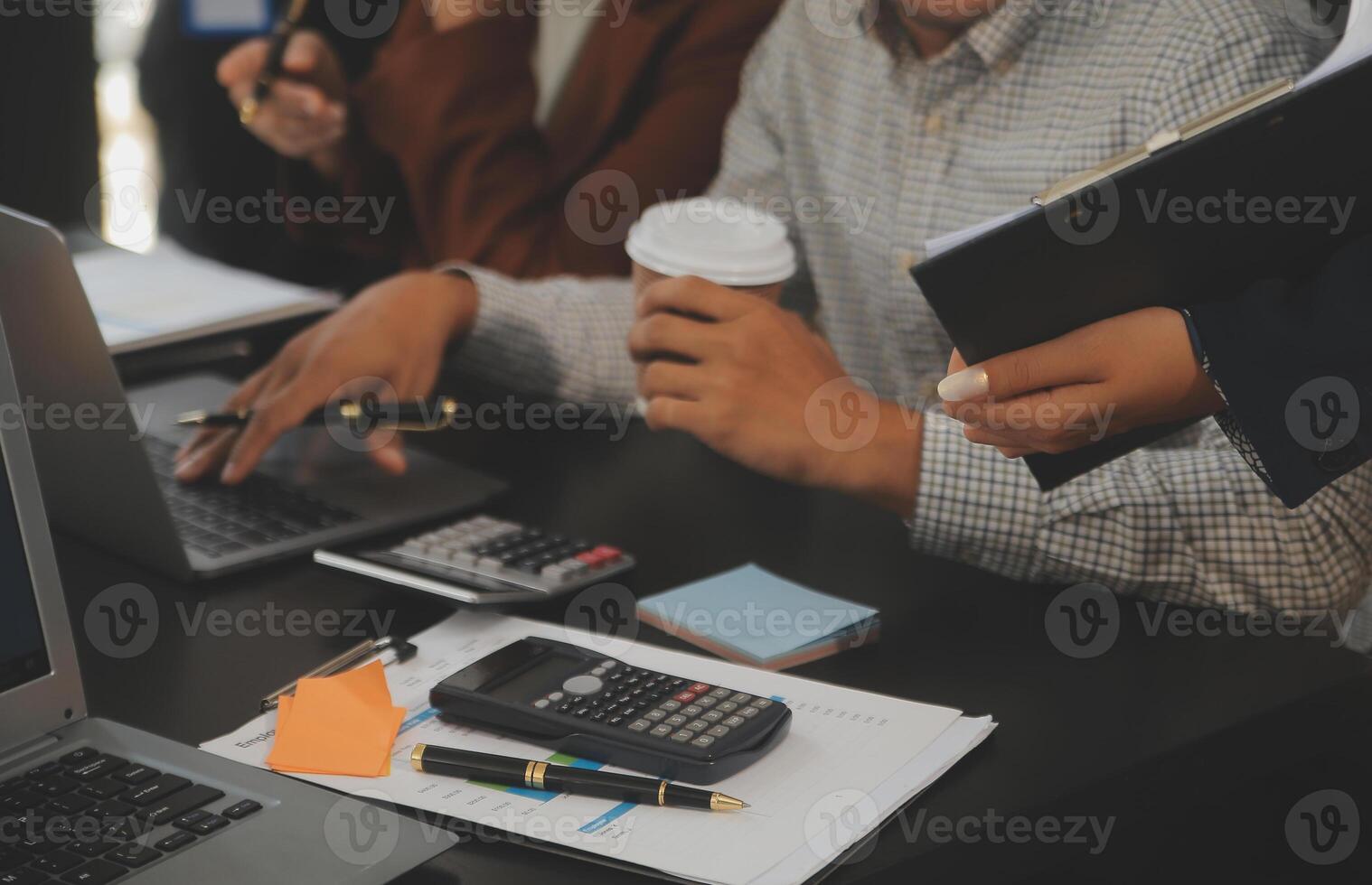 Business team meeting working with new startup project, discussion and analysis data the charts and graphs. Digital tablet, calculator, laptop computer using, Business finance and accounting concept. photo