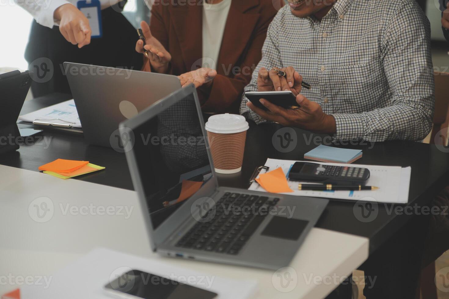 Business team meeting working with new startup project, discussion and analysis data the charts and graphs. Digital tablet, calculator, laptop computer using, Business finance and accounting concept. photo