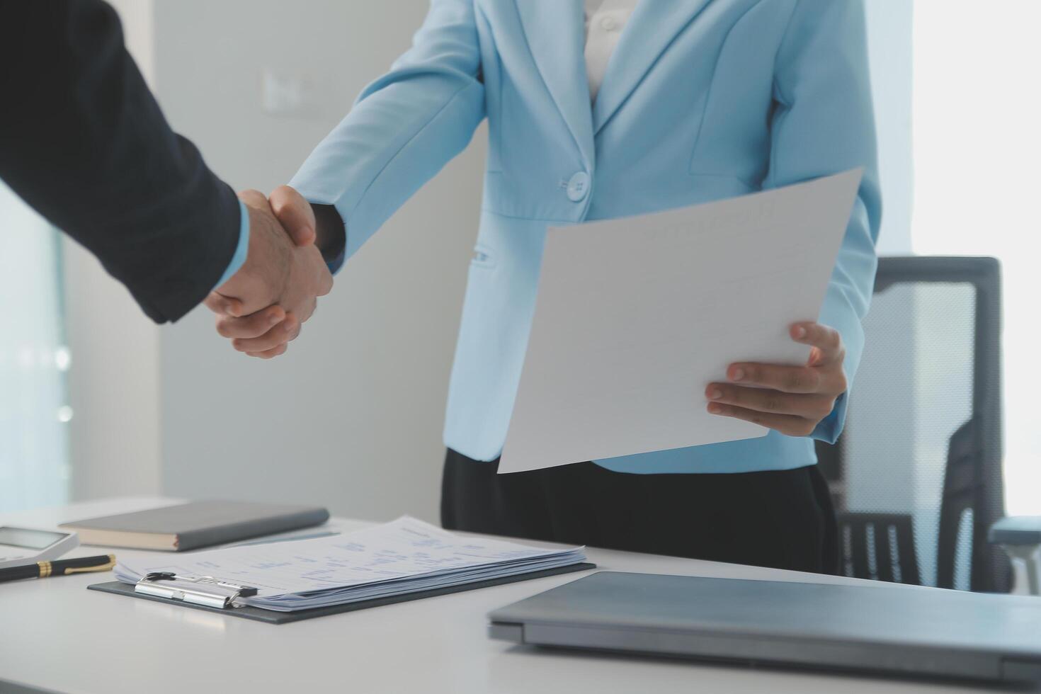 Close up view of job interview in office, focus on resume writing tips, employer reviewing good cv of prepared skilled applicant, recruiter considering application, hr manager making hiring decision photo