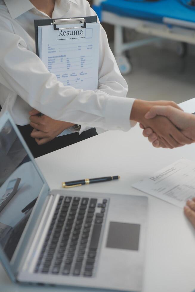 Close up view of job interview in office, focus on resume writing tips, employer reviewing good cv of prepared skilled applicant, recruiter considering application, hr manager making hiring decision photo