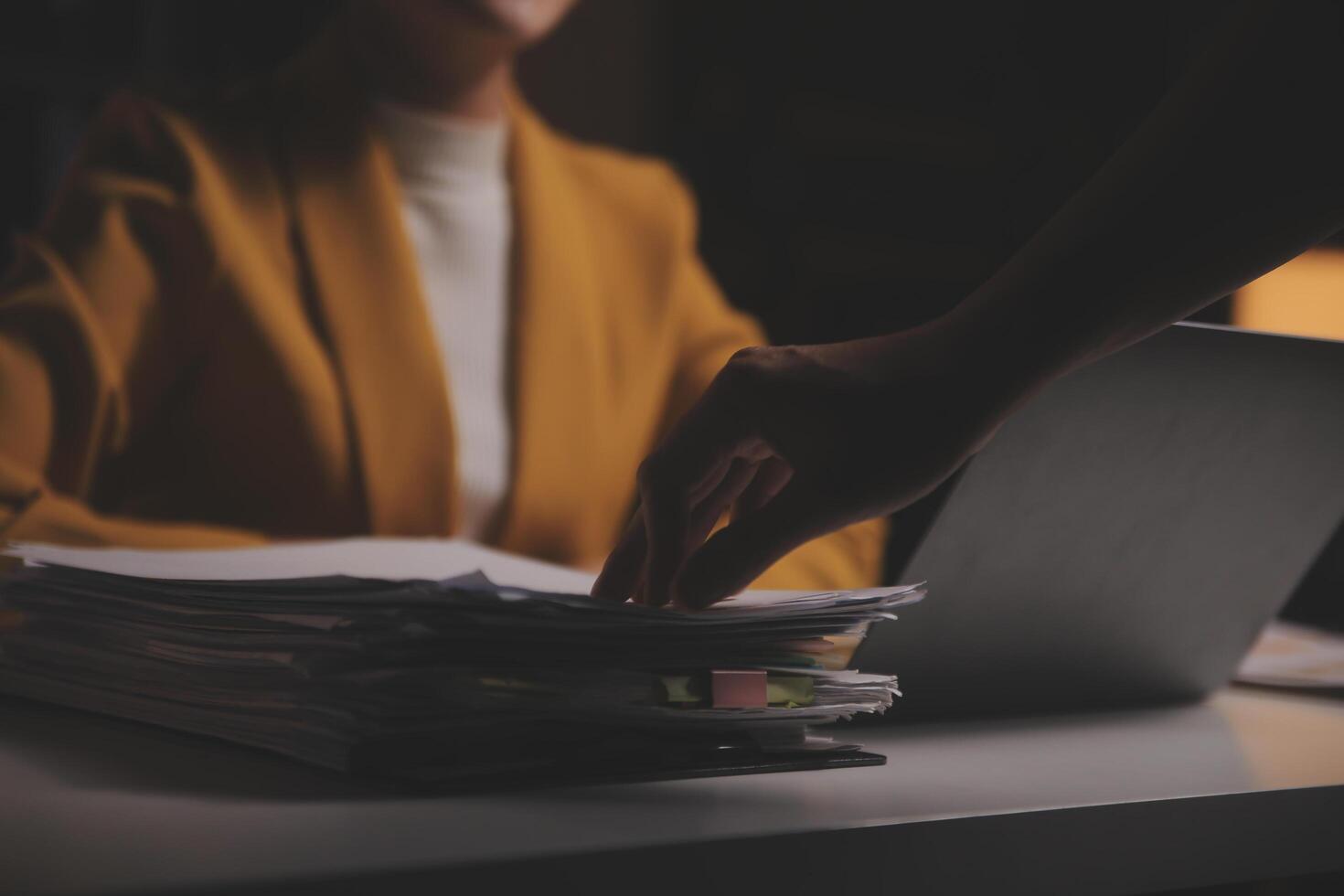 Business woman using calculator for do math finance on wooden desk in office and business working background, tax, accounting, statistics and analytic research concept photo