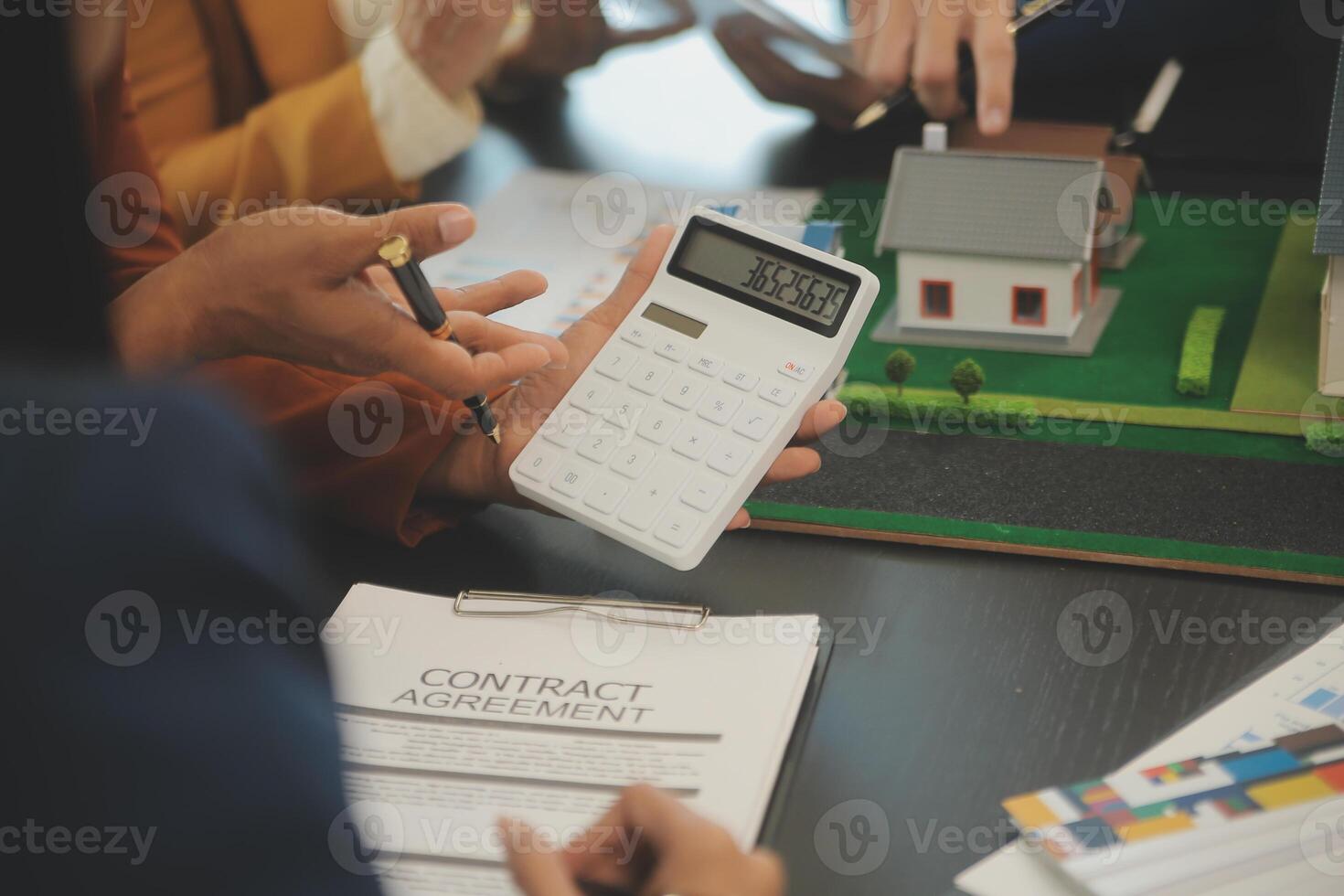 Team of architectures and businessmen discussing and brainstorming on floor plan modification for real estate investment and housing development project photo