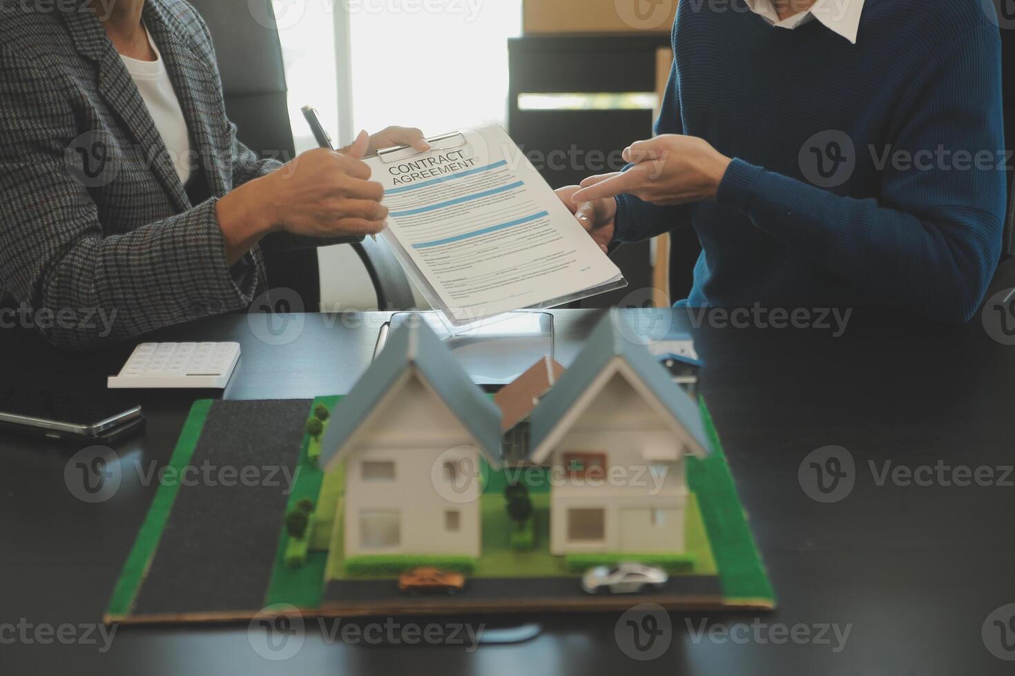 Team of architectures and businessmen discussing and brainstorming on floor plan modification for real estate investment and housing development project photo