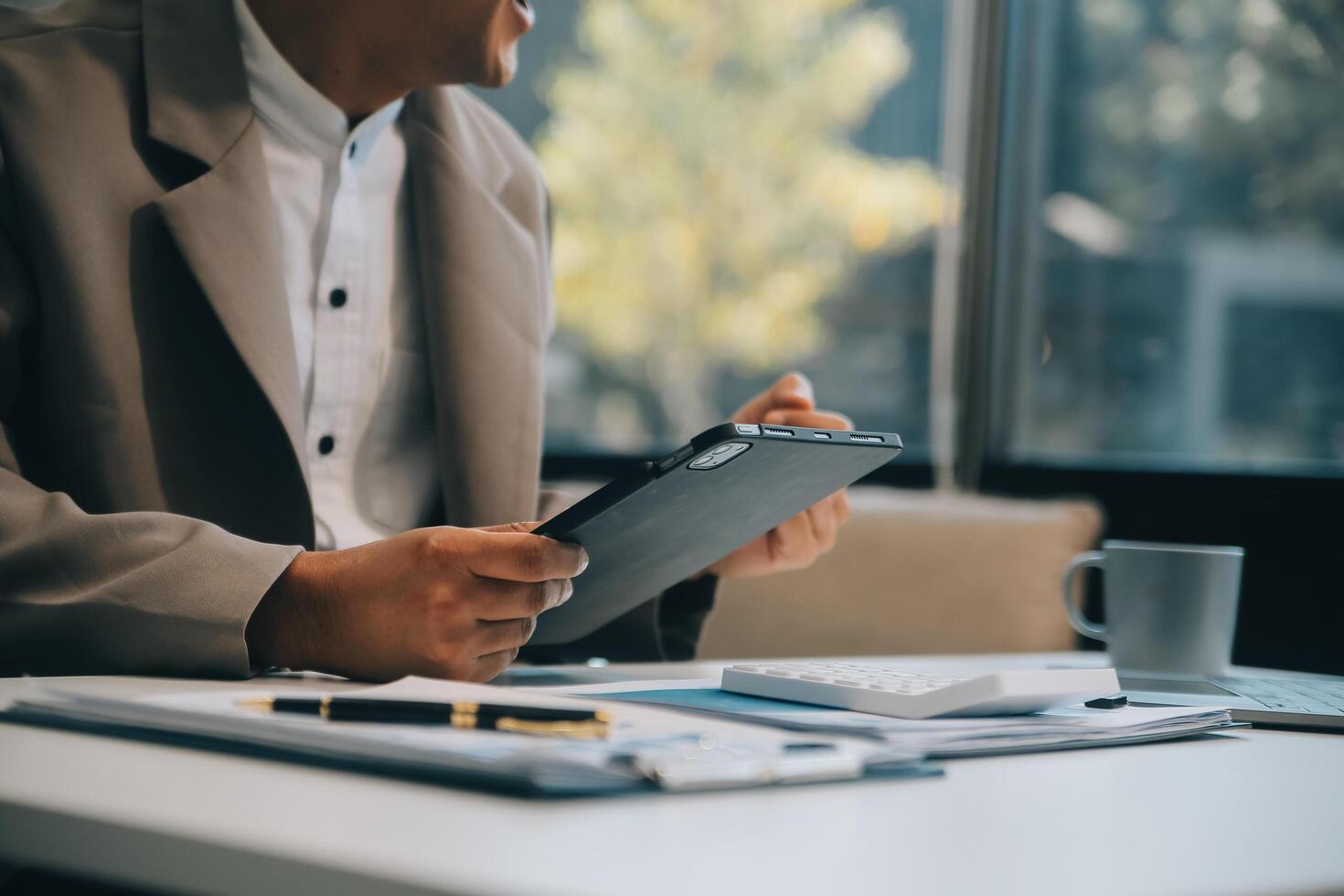 Office, tablet and business man happy for positive financial savings, finance budget report or administration feedback. Growth analytics, data analysis review and person smile for research statistics photo