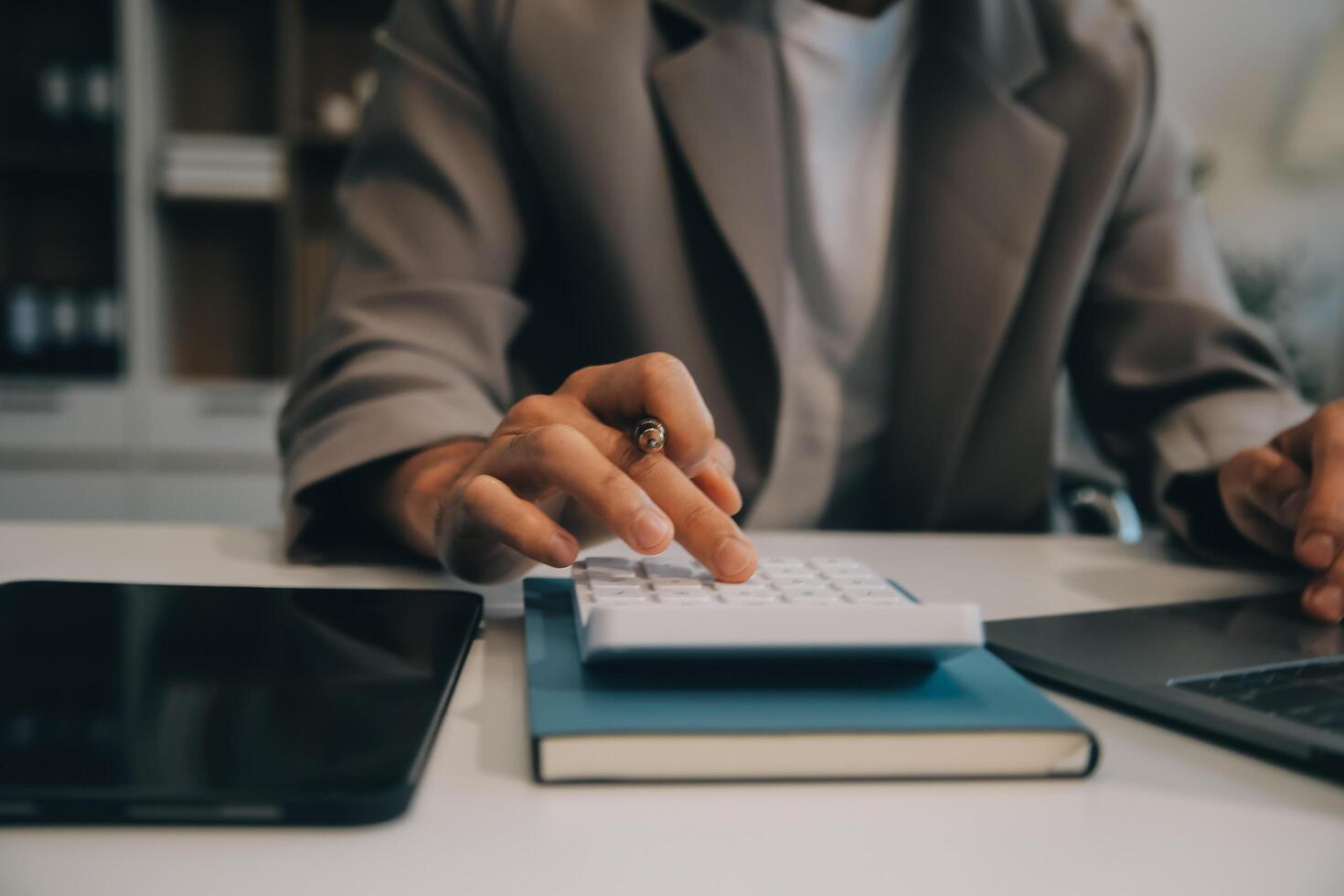 Business team working with new startup project plan and discussion information for financial strategy with laptop and digital tablet in a modern business lounge. photo