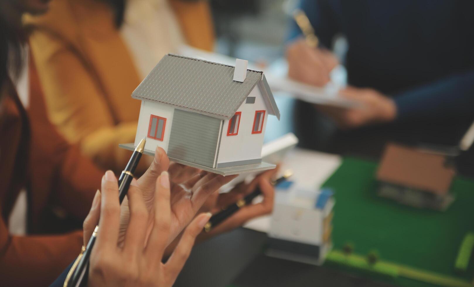 Team of architectures and businessmen discussing and brainstorming on floor plan modification for real estate investment and housing development project photo