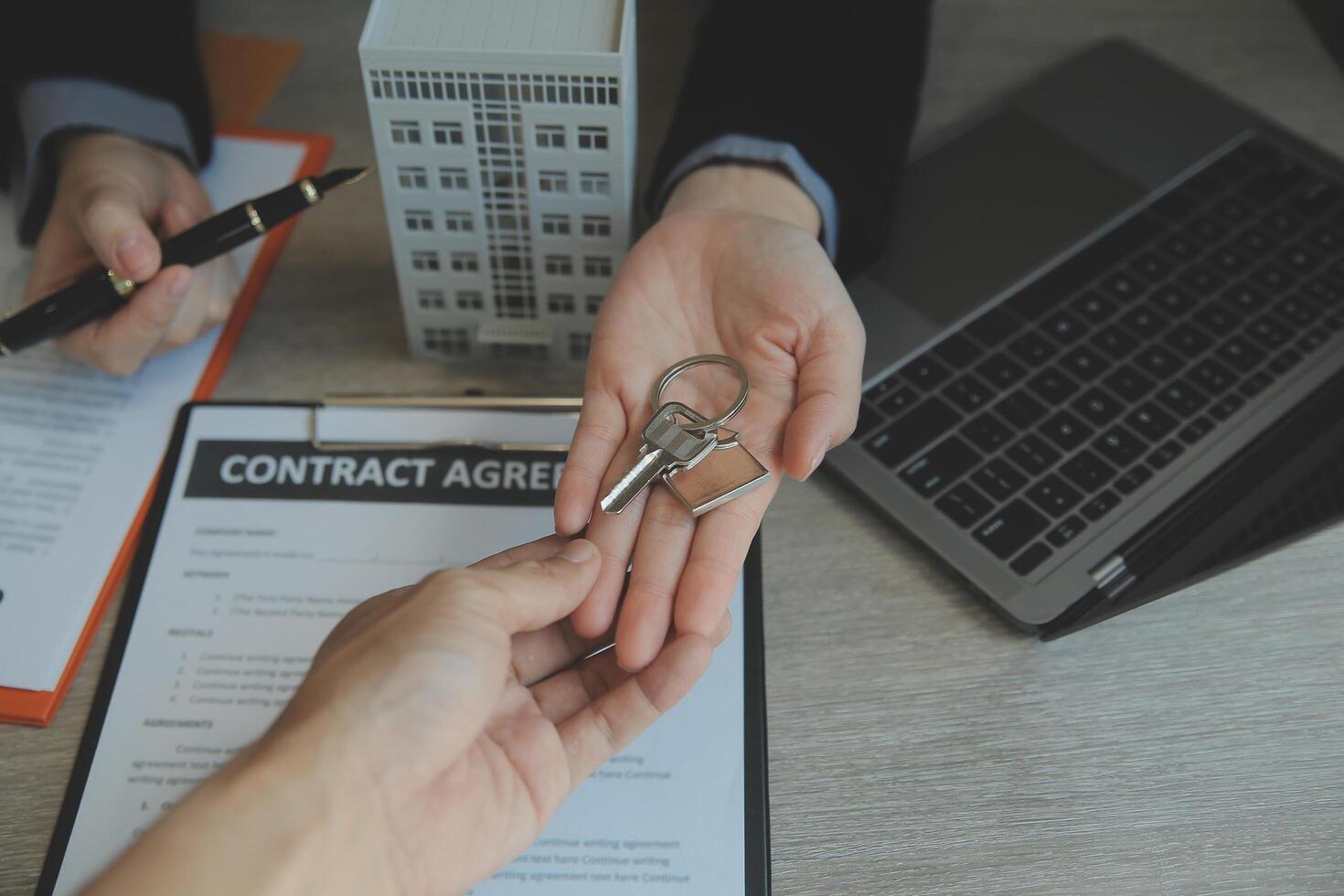 Real estate agent and customer signing contract to buy house, insurance or loan real estate.rent a house,get insurance or loan real estate or property. photo