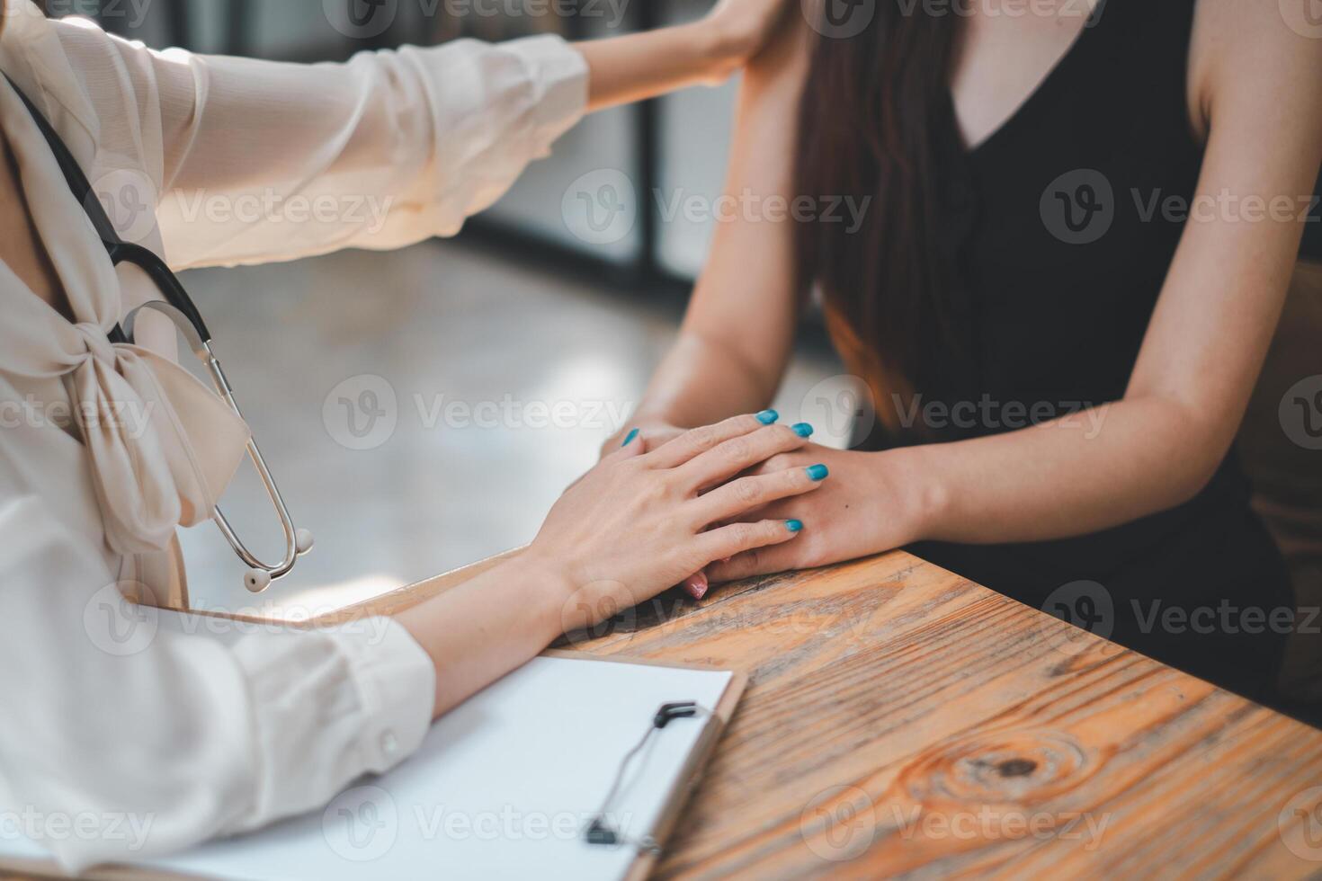 Employee receives a consultation from a healthcare professional, discussing health matters in a modern office environment. photo