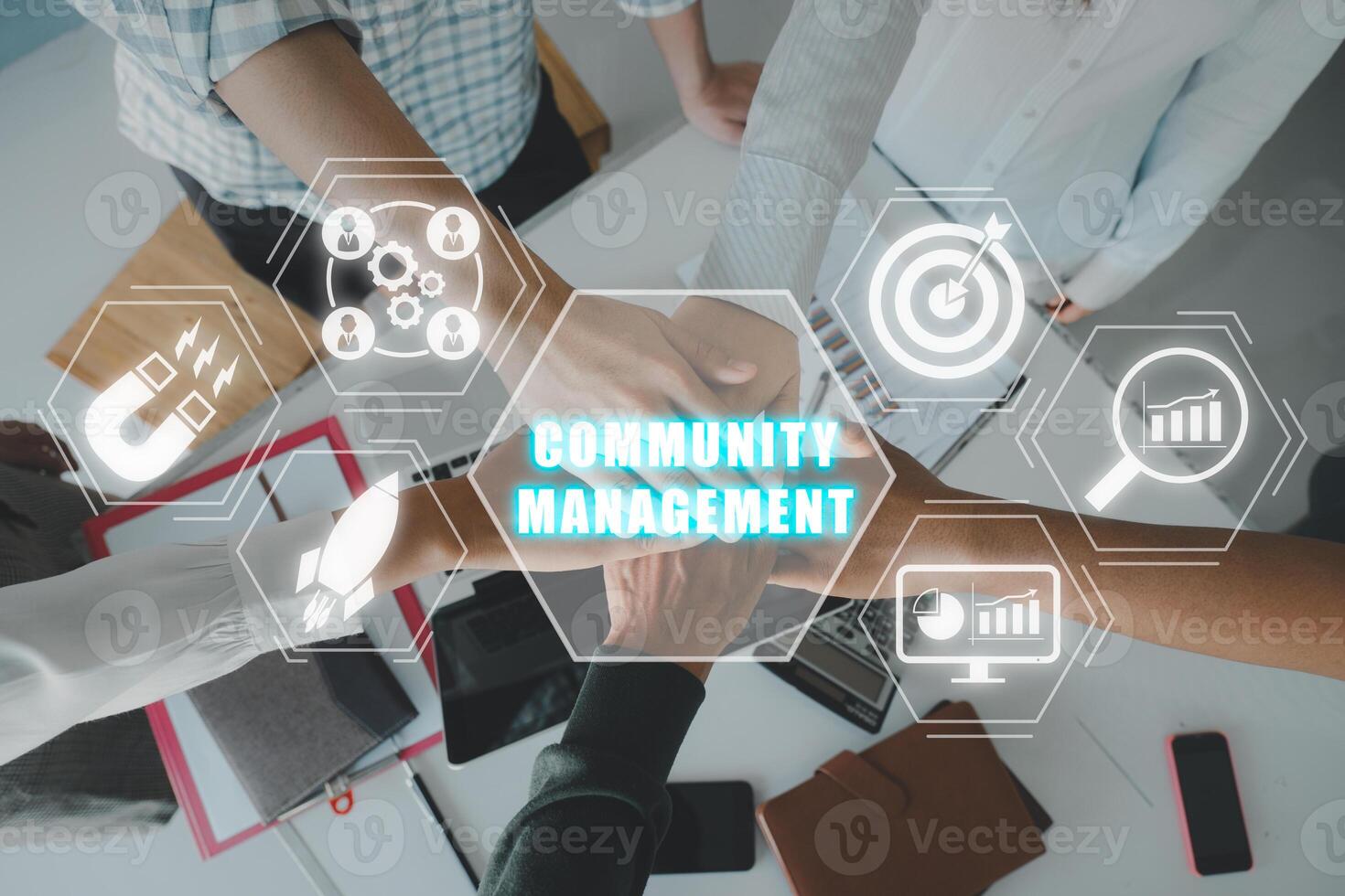 Community management concept, Positive diverse business team putting their hands on top of each other with community management icon on virtual screen. photo