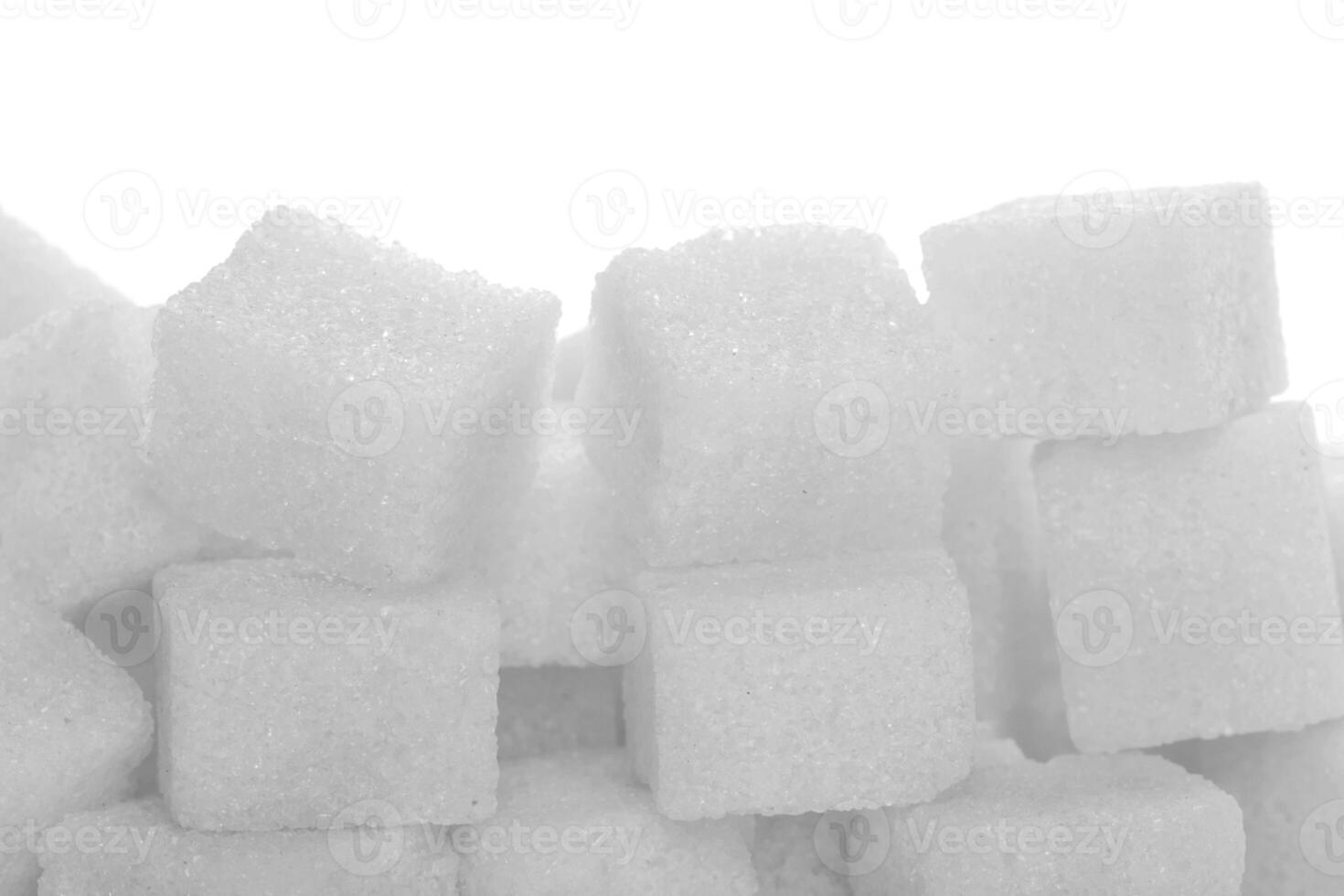 Sugar cubes on white photo