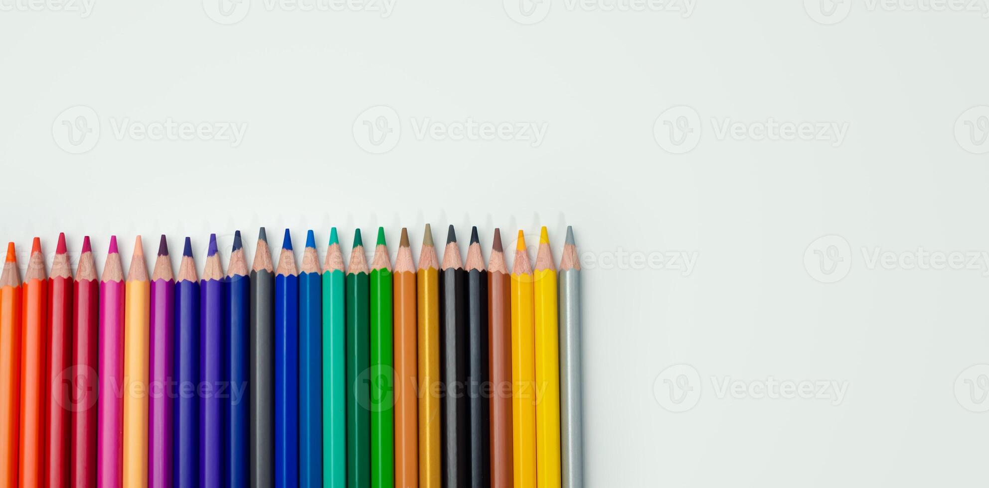 Set of colored pencils on a white background That is arranged in a bar graph, Color pencils on white background, Close up, seamless colored pencils row with wave on lower side, line pencils. photo