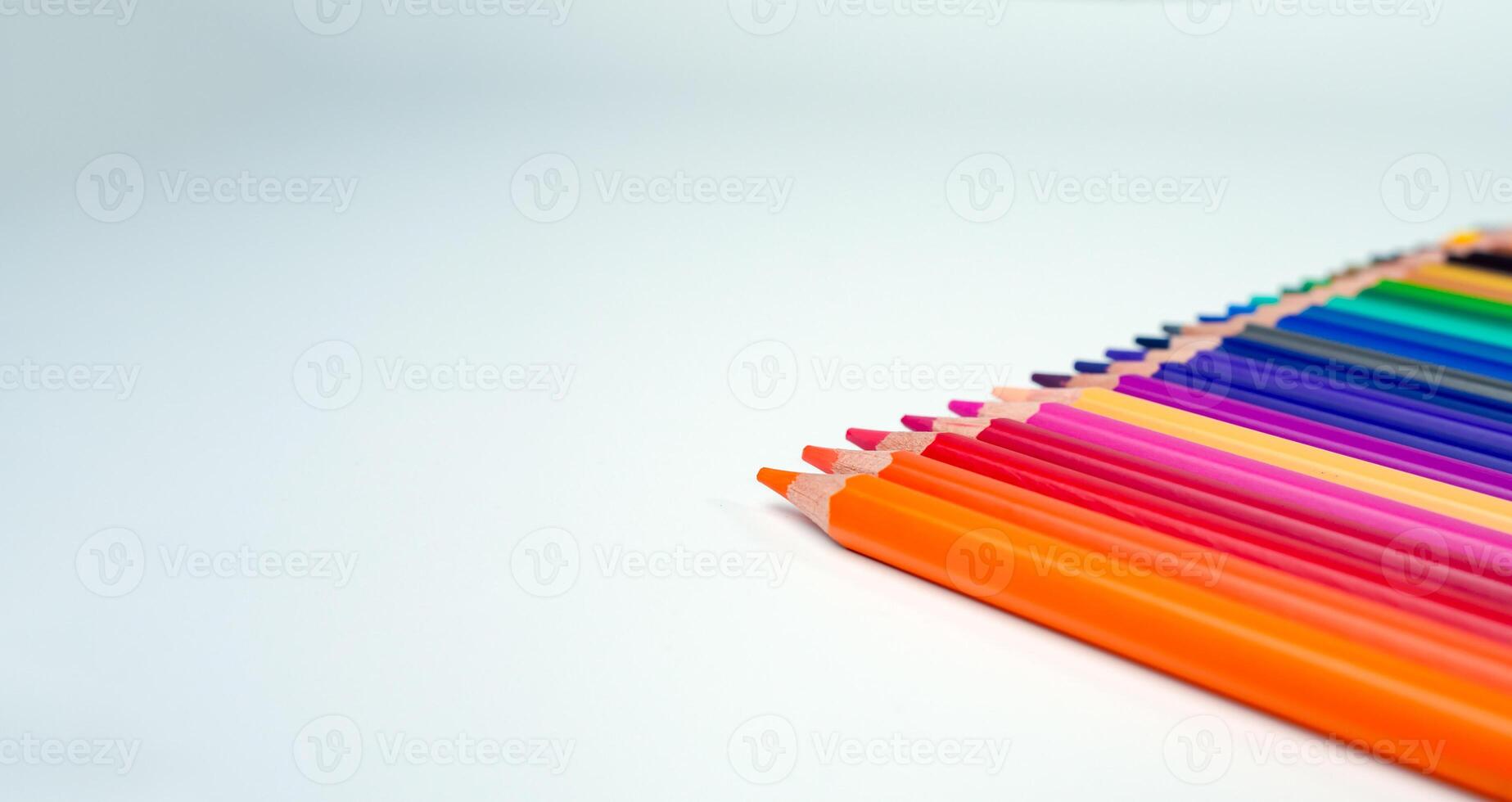 Set of colored pencils on a white background That is arranged in a bar graph, Color pencils on white background, Close up, seamless colored pencils row with wave on lower side, line pencils. photo