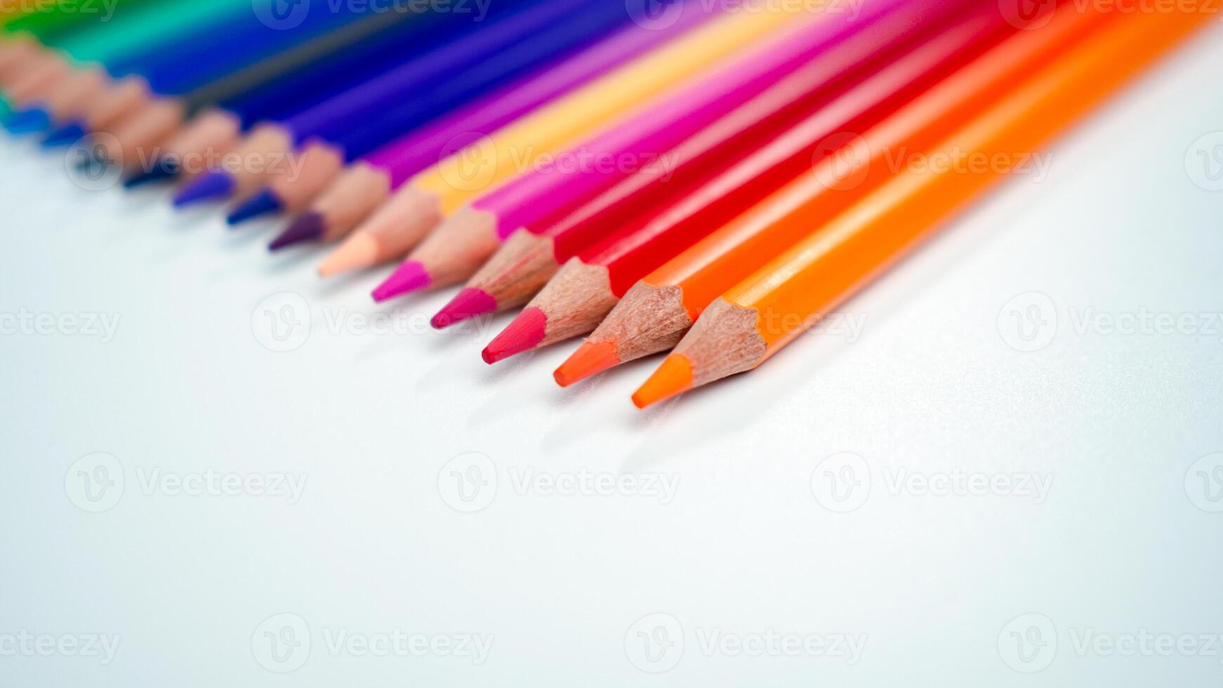 Set of colored pencils on a white background That is arranged in a bar graph, Color pencils on white background, Close up, seamless colored pencils row with wave on lower side, line pencils. photo