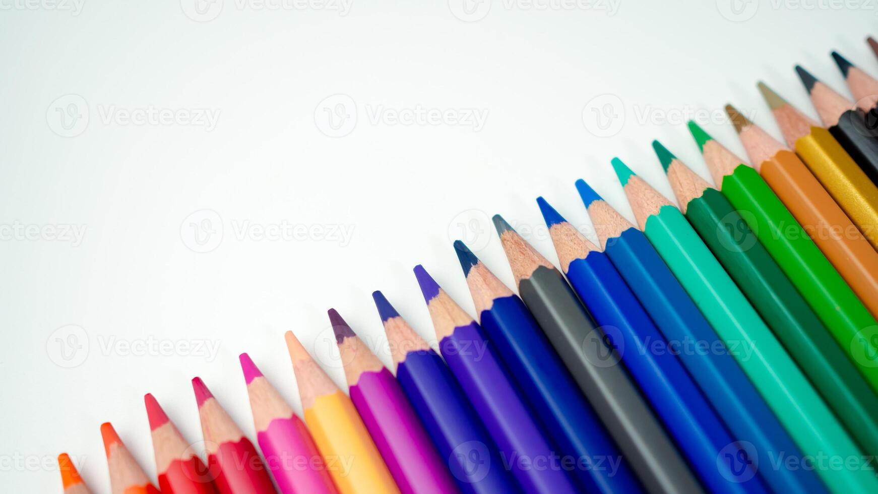 Set of colored pencils on a white background That is arranged in a bar graph, Color pencils on white background, Close up, seamless colored pencils row with wave on lower side, line pencils. photo