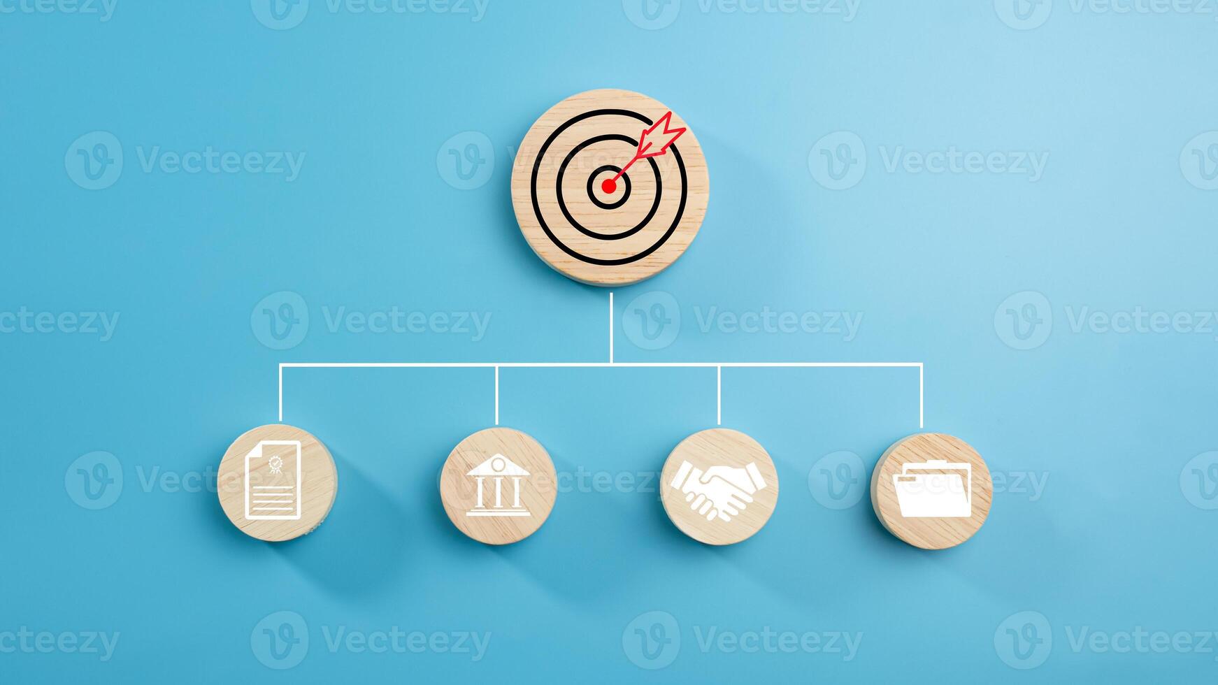 Circular wood with printed target icons and business symbols on light blue background, business goals and objectives concept, business competition, Customer relationship management concept. photo