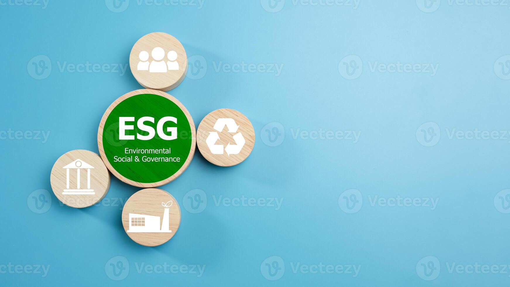 ESG concepts for sustainable environment, society and governance Businesses are environmentally responsible, A circular wooden board with the abbreviation ESG printed on a light blue background. photo