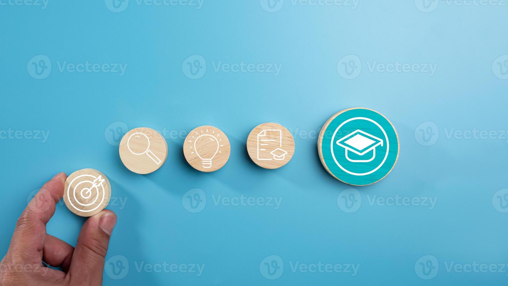 Circular wooden board with graduation and education symbols linked with each other with lines, Success and necessary skills in graduation or education, Knowledge and teaching. photo