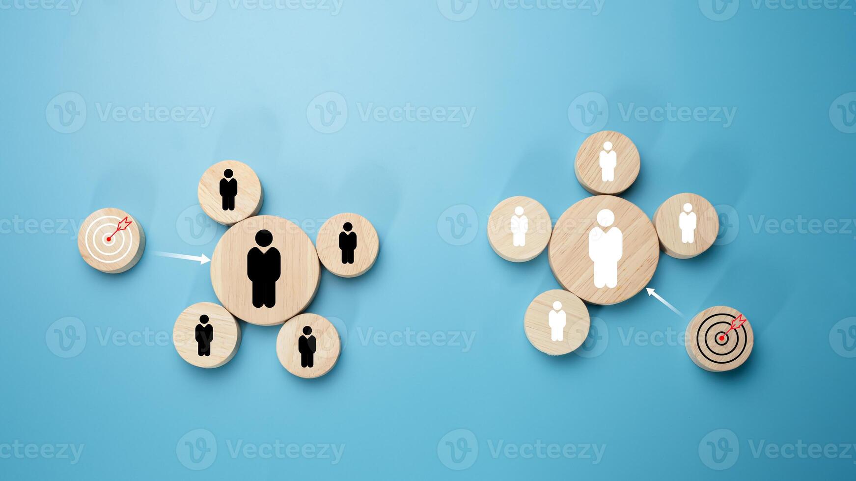 Circular wood with printed target icons and business symbols on light blue background, business goals and objectives concept, business competition, Customer relationship management concept. photo