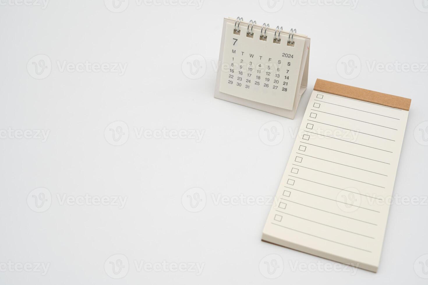 Empty Check list for text with checkbox and Simple desk calendar for JULY 2024. Blank to do list for text in JUL. Copy Space. photo