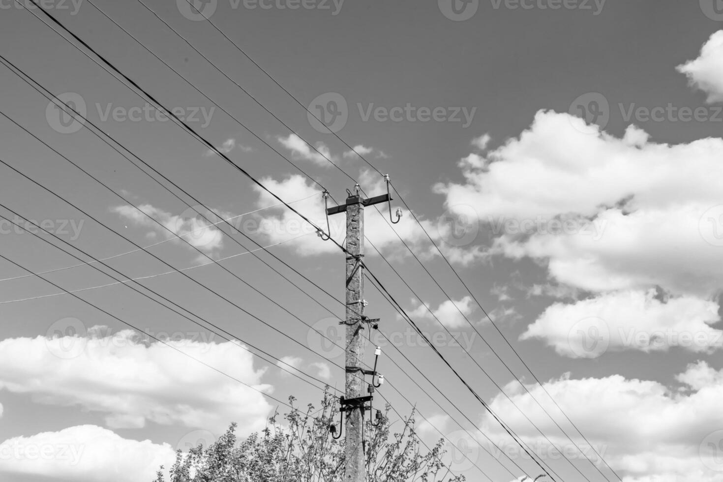 Power electric pole with line wire on light background close up photo