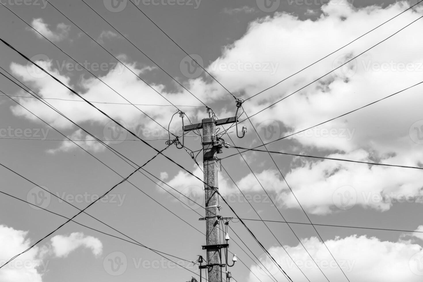 Power electric pole with line wire on light background close up photo