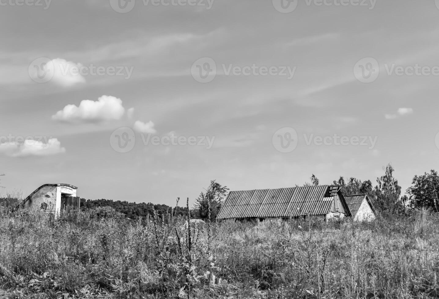 Beautiful old abandoned building farm house in countryside on natural background photo