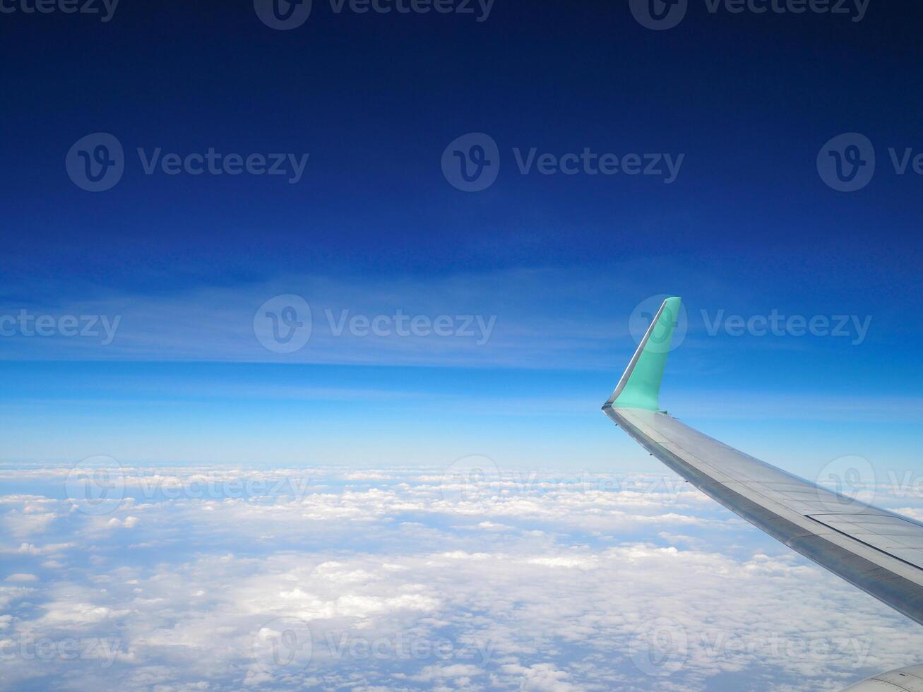 Aerial view of sky seen through the airplane window. Space for text photo