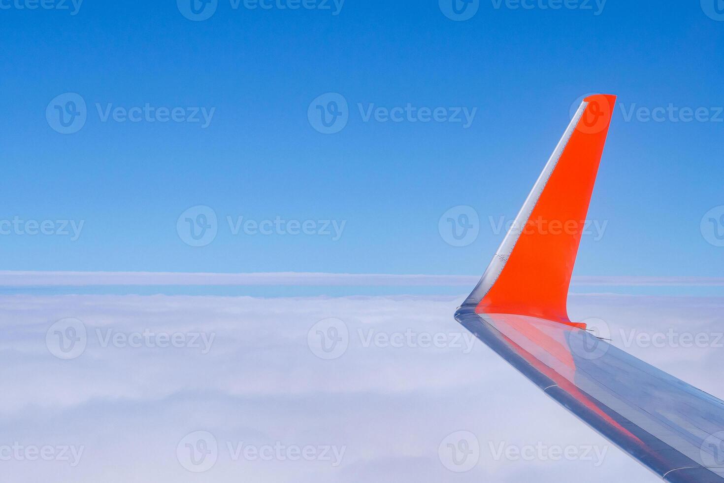 Aerial view of cloudscape seen through the airplane window. Feeling freedom and new inspiration. Skyline background with copy space for text photo