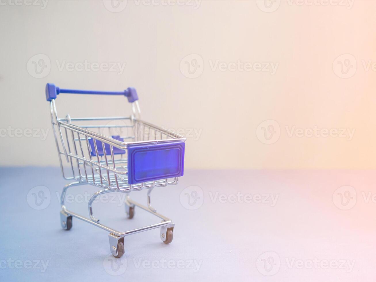 Shopping cart with sunlight effect with copy space for text. Concept of e-commerce photo