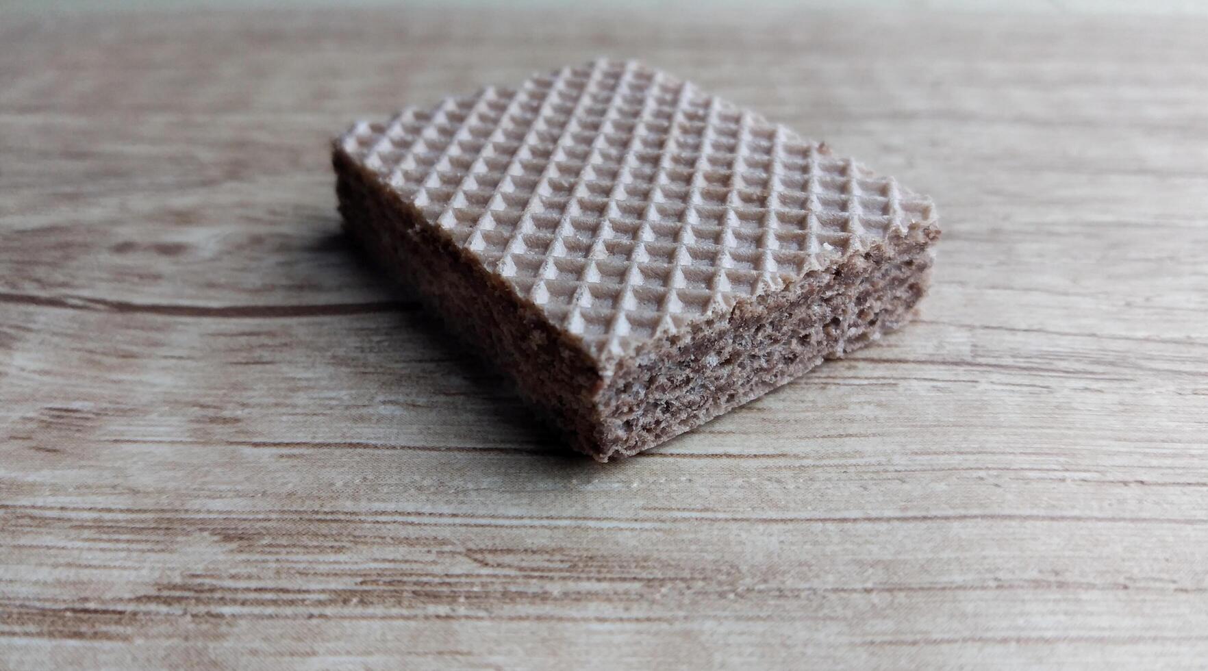 Chocolate wafers on a wooden background. Selective focus. photo