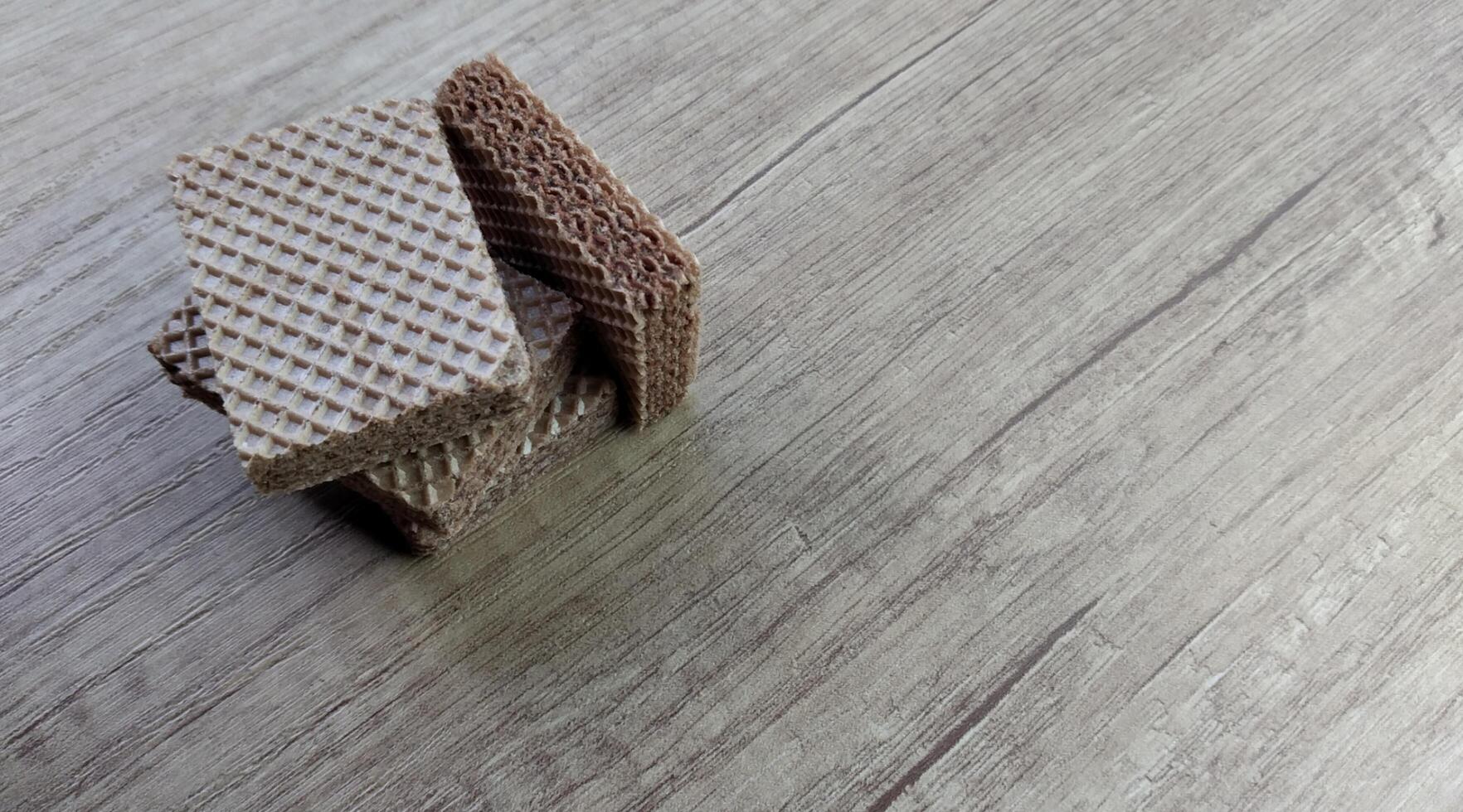 Chocolate wafers on wooden background. Selective focus. photo