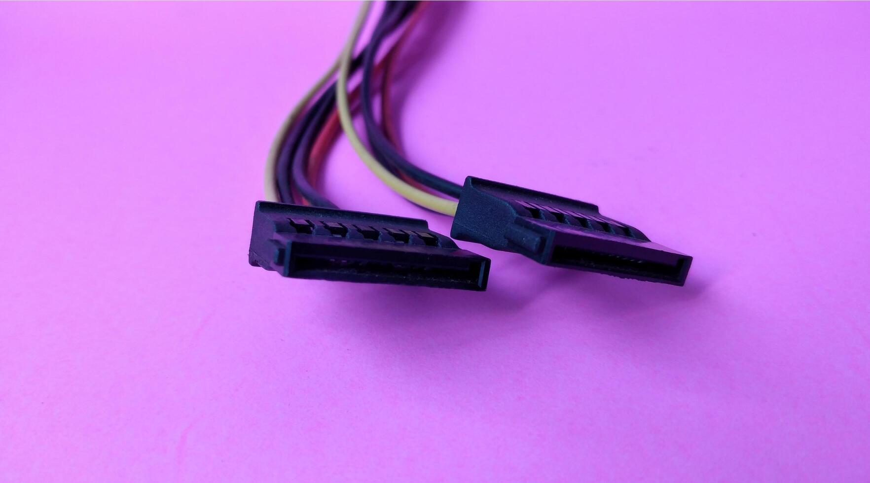 Close up of computer cable isolated on pink background with copy space. photo
