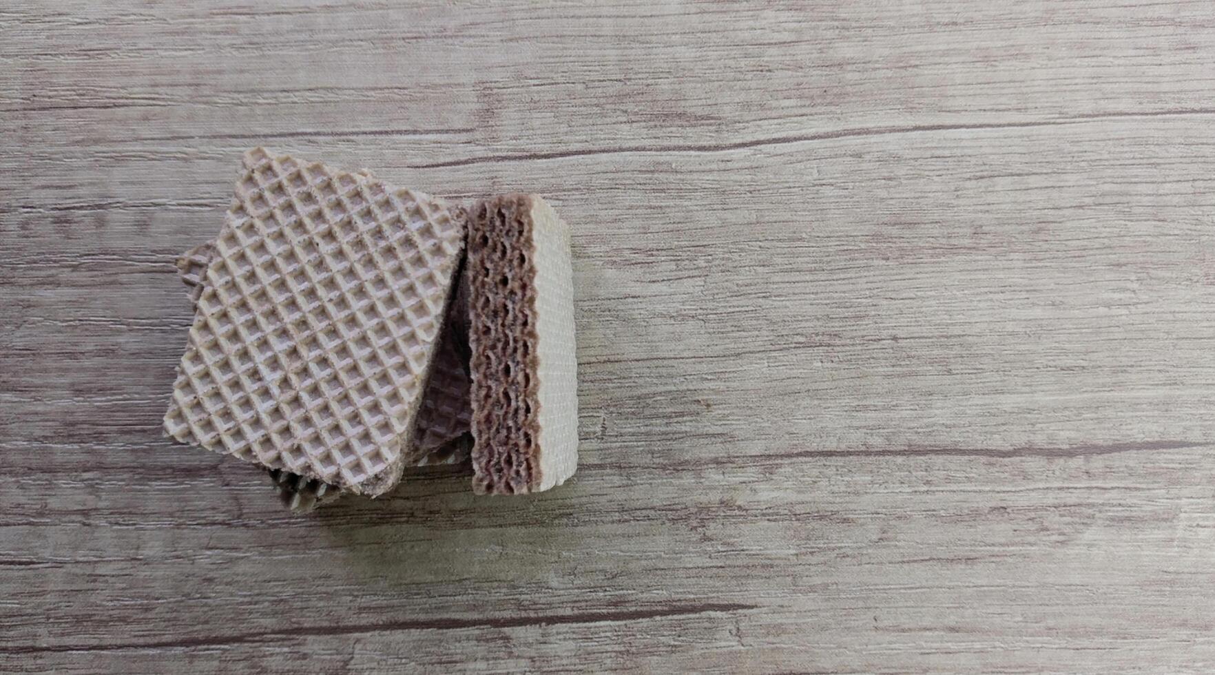 Chocolate wafers on wooden background. Selective focus. photo