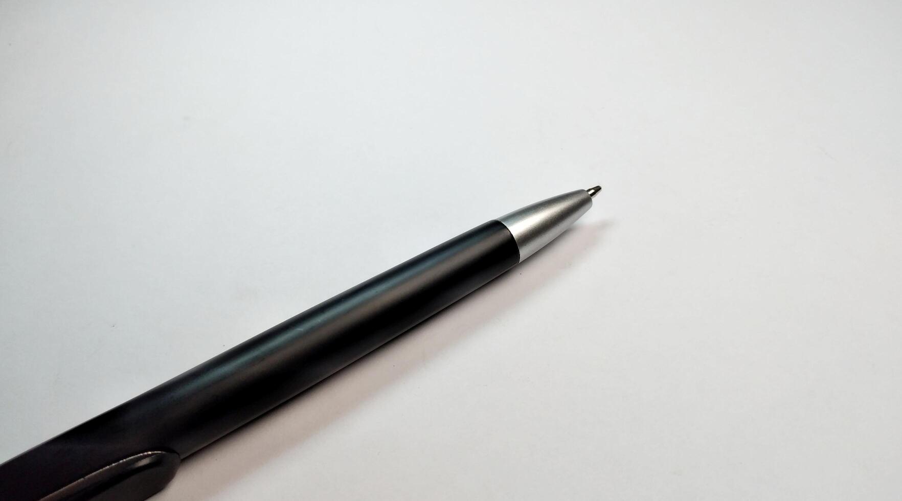 Pen on a white background, close-up, selective focus. photo