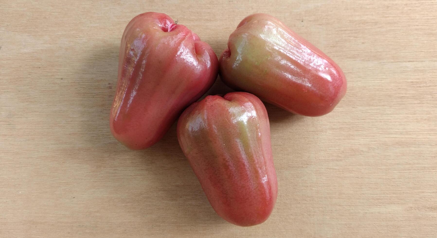 Rose apple on wood background, top view of fresh rose apple. photo