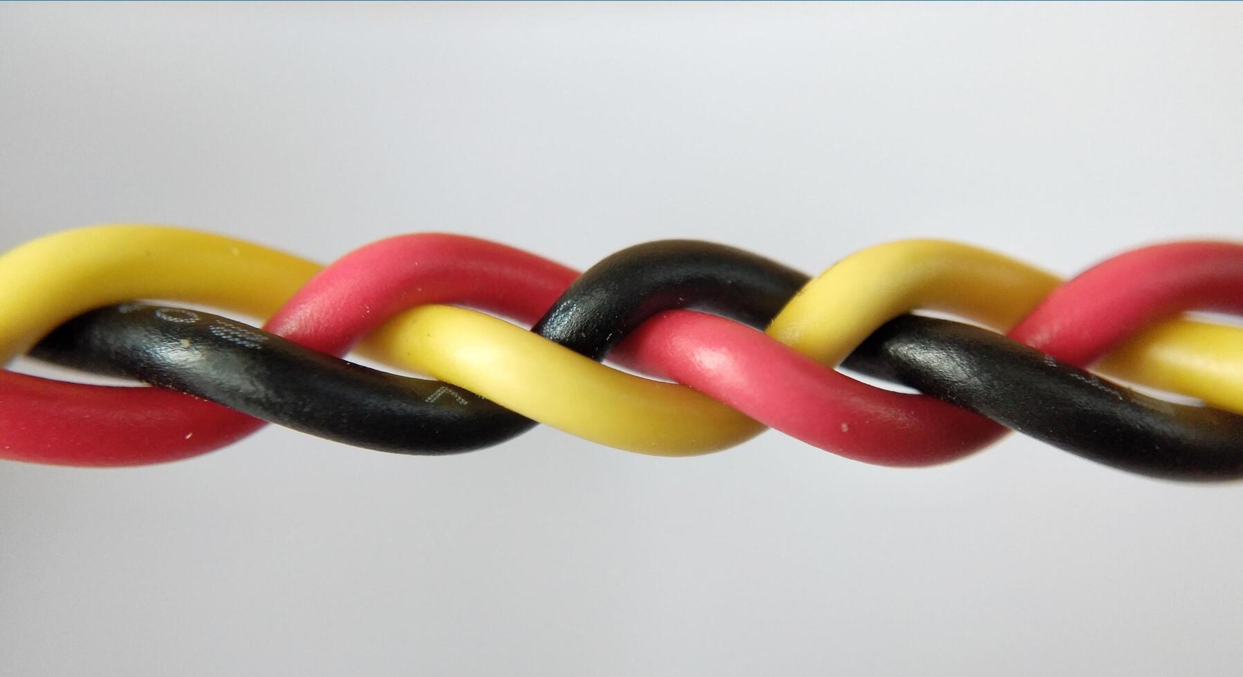 Multicolored electrical cable on a white background close-up. photo