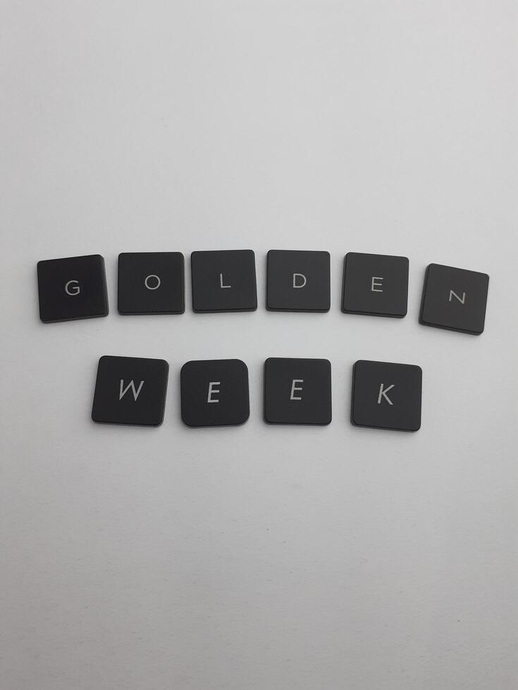 Keyboard with the word golden week written in black on a white background photo