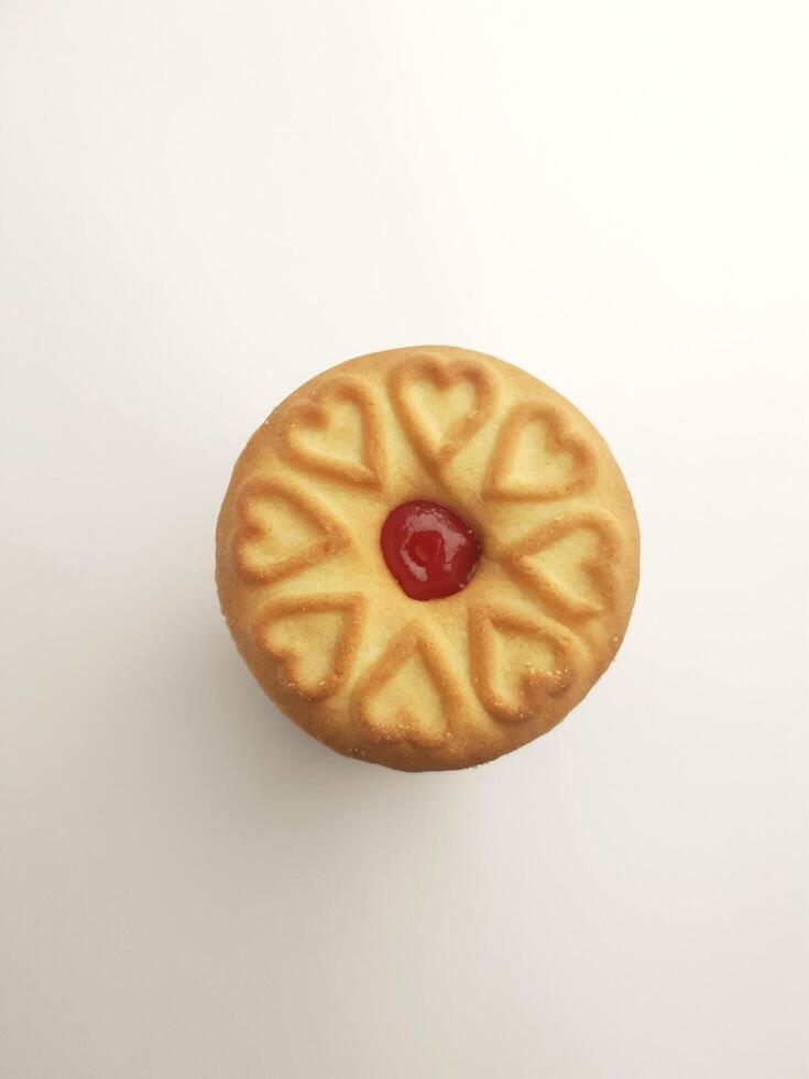 cookies with strawberry jam on a white background, close up photo