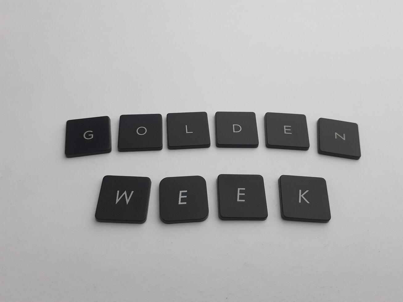 Keyboard with the word golden week written in black on a white background photo