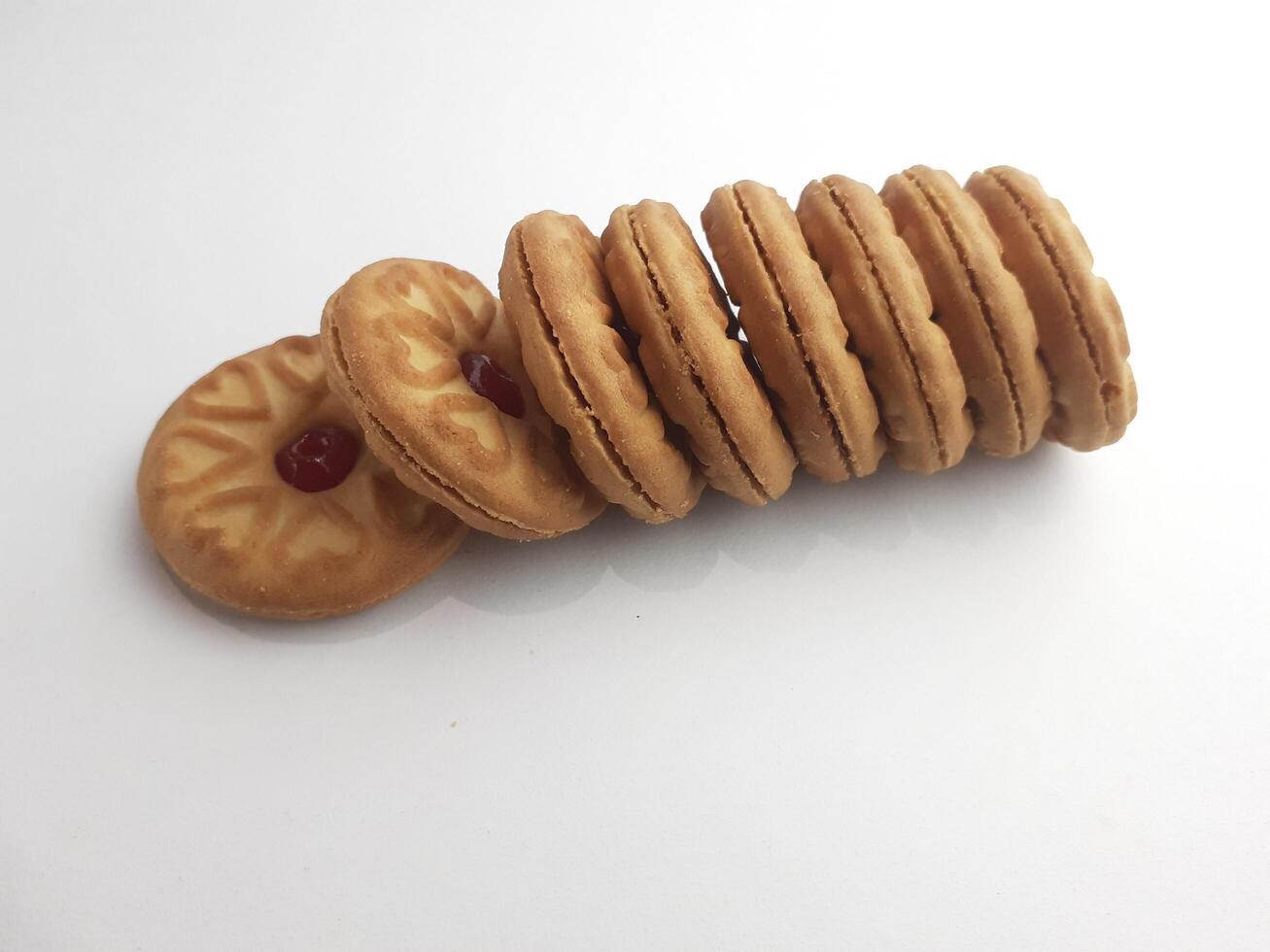 cookies with strawberry jam on a white background, close up photo