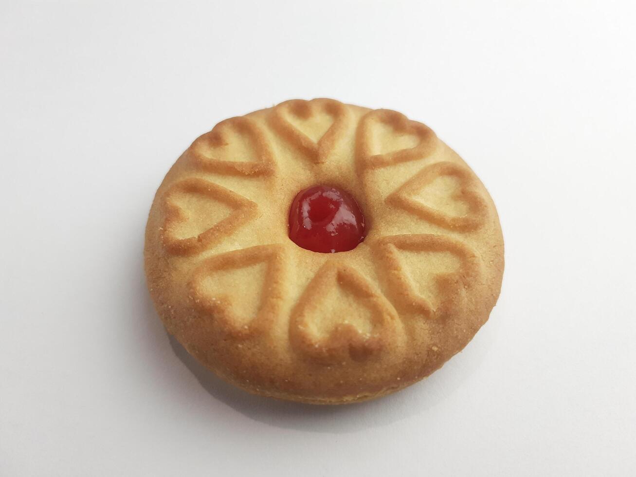 cookies with strawberry jam on a white background, close up photo