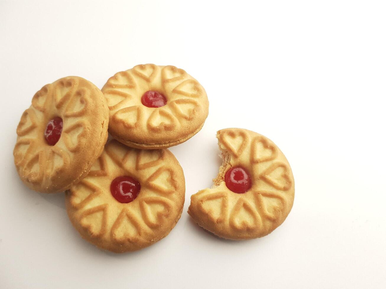 cookies with strawberry jam on a white background, close up photo