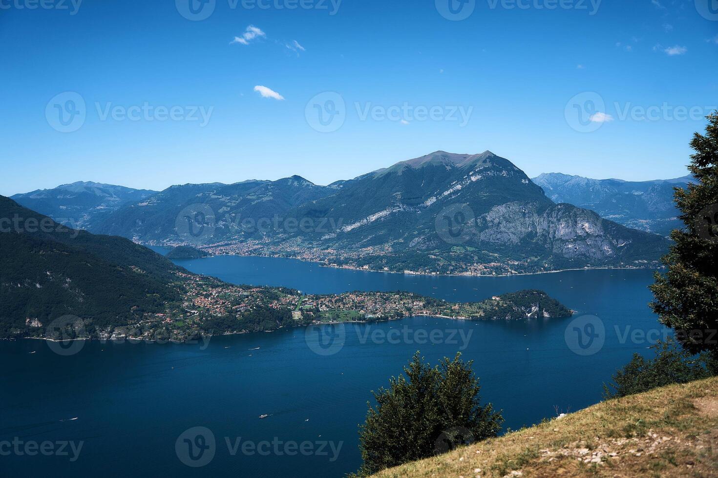 Lake Como with charming yachts surrounded by hills photo