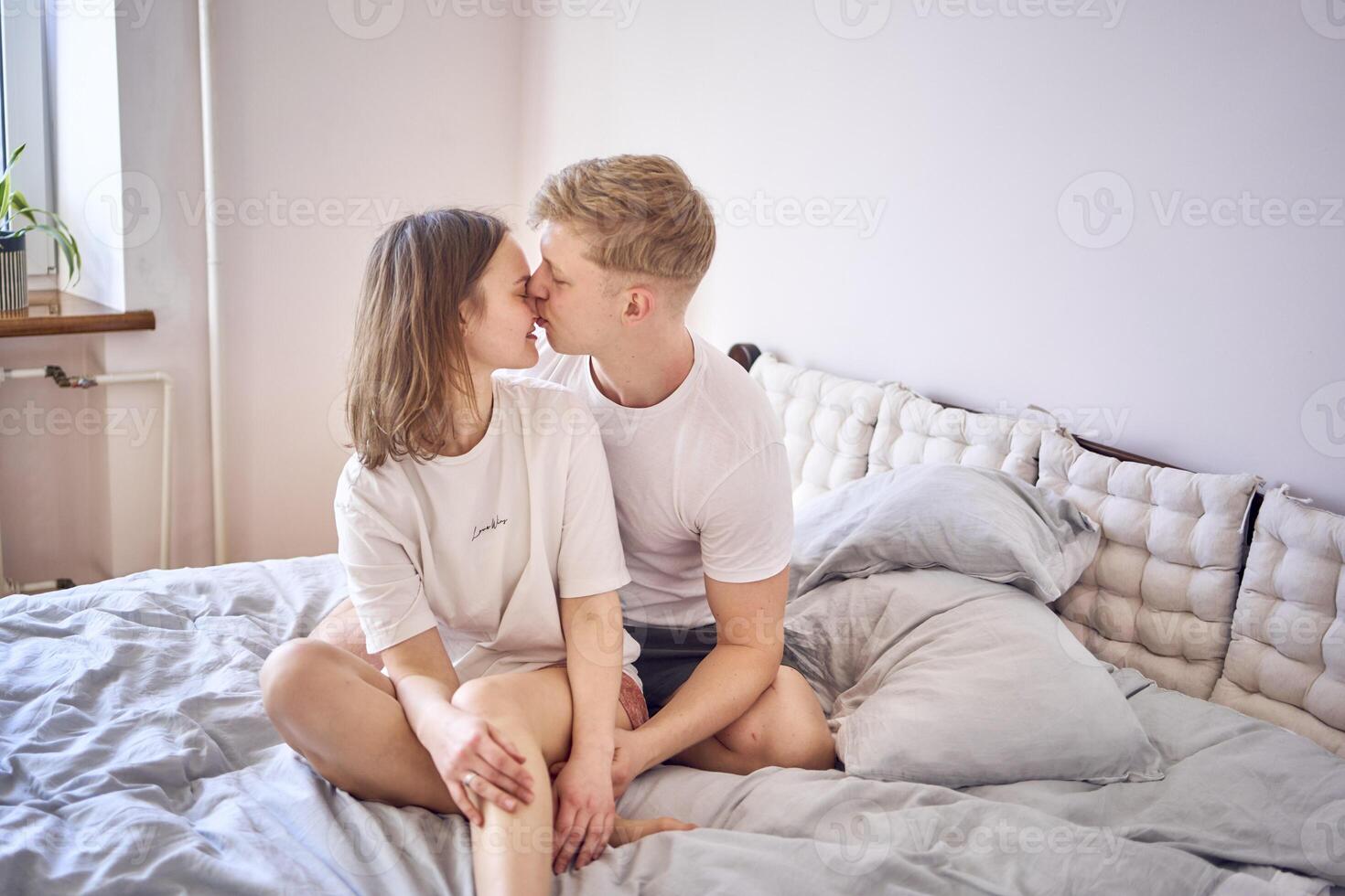 tender embrace of young man and woman at home photo