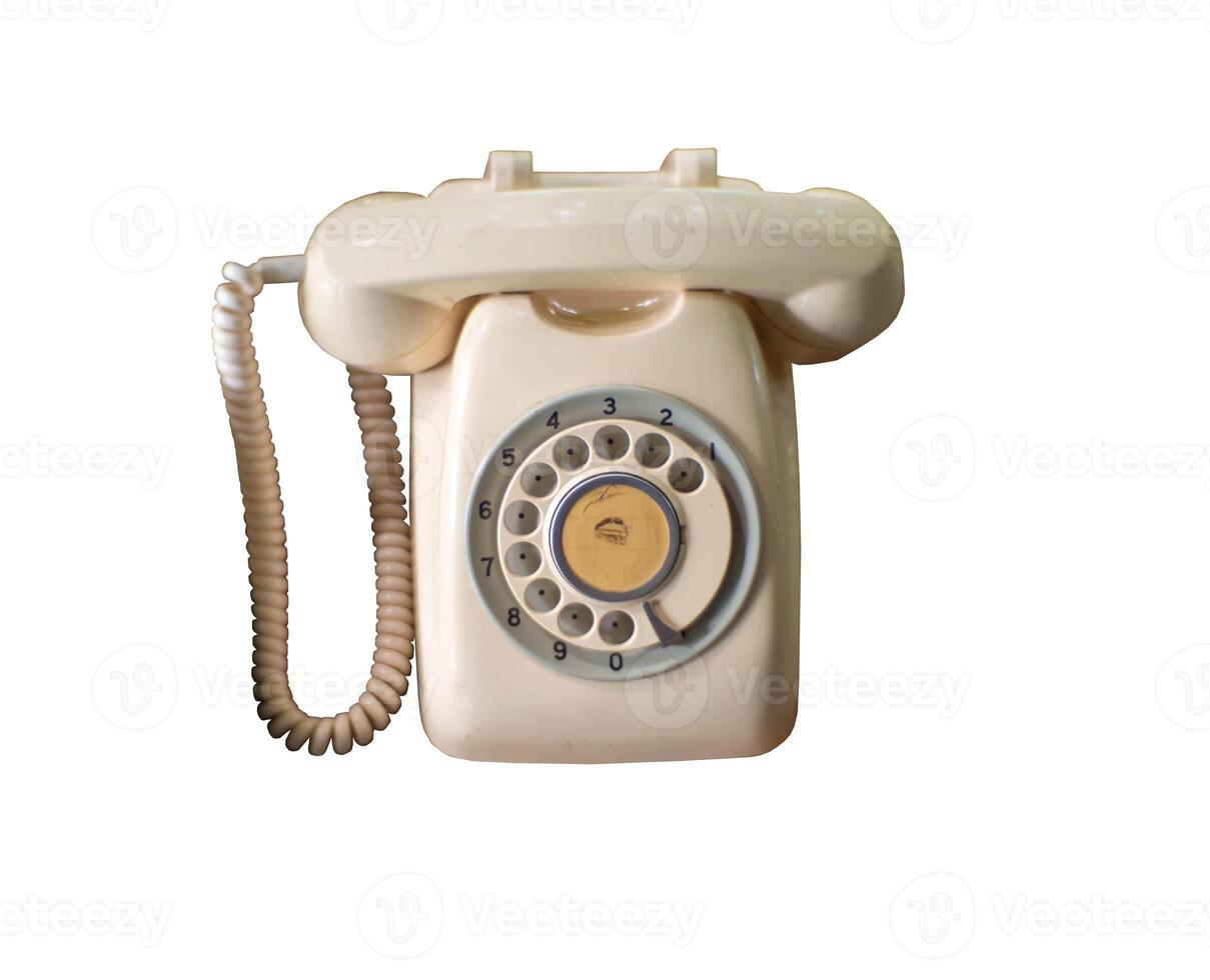 Isolated vintage rotary telephone on white bg photo