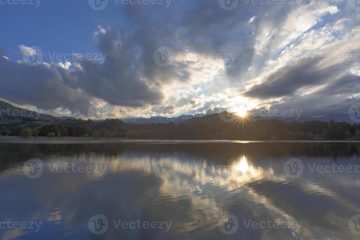 Sun starburst at sunset photo